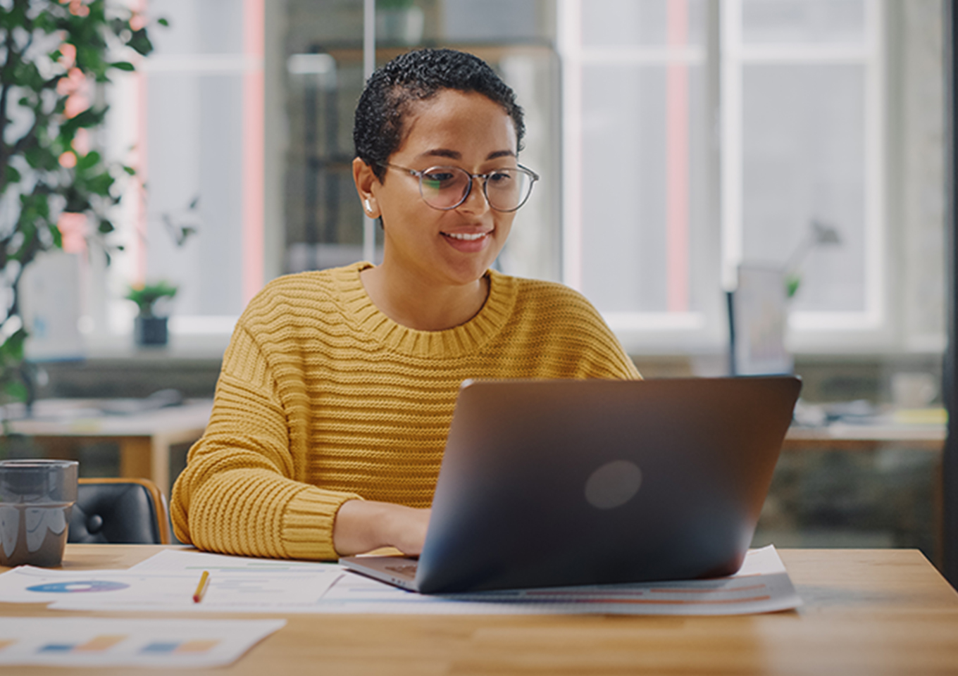student doing work on their laptop